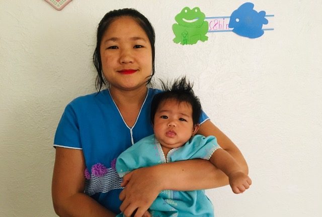 Mya Nay and her baby Shiny Bather. Mya Nay is one of the 37 mothers in KOM's Postpartum Home Visit Program.
