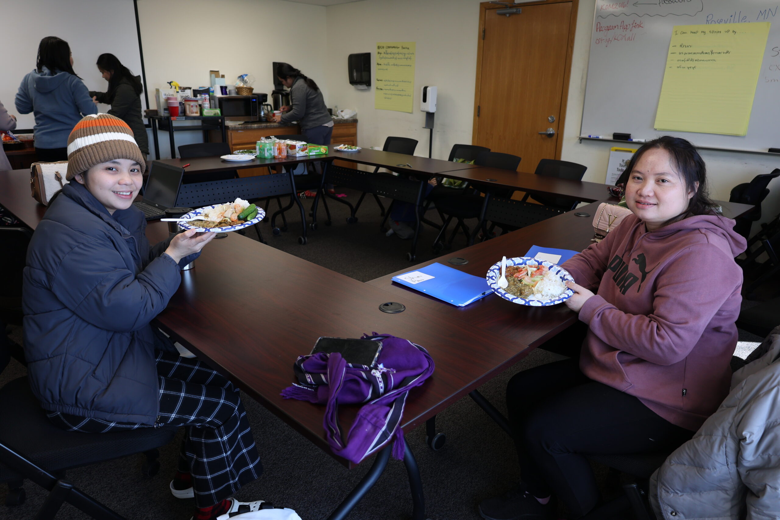 Two of our caregivers enjoying food after a training.