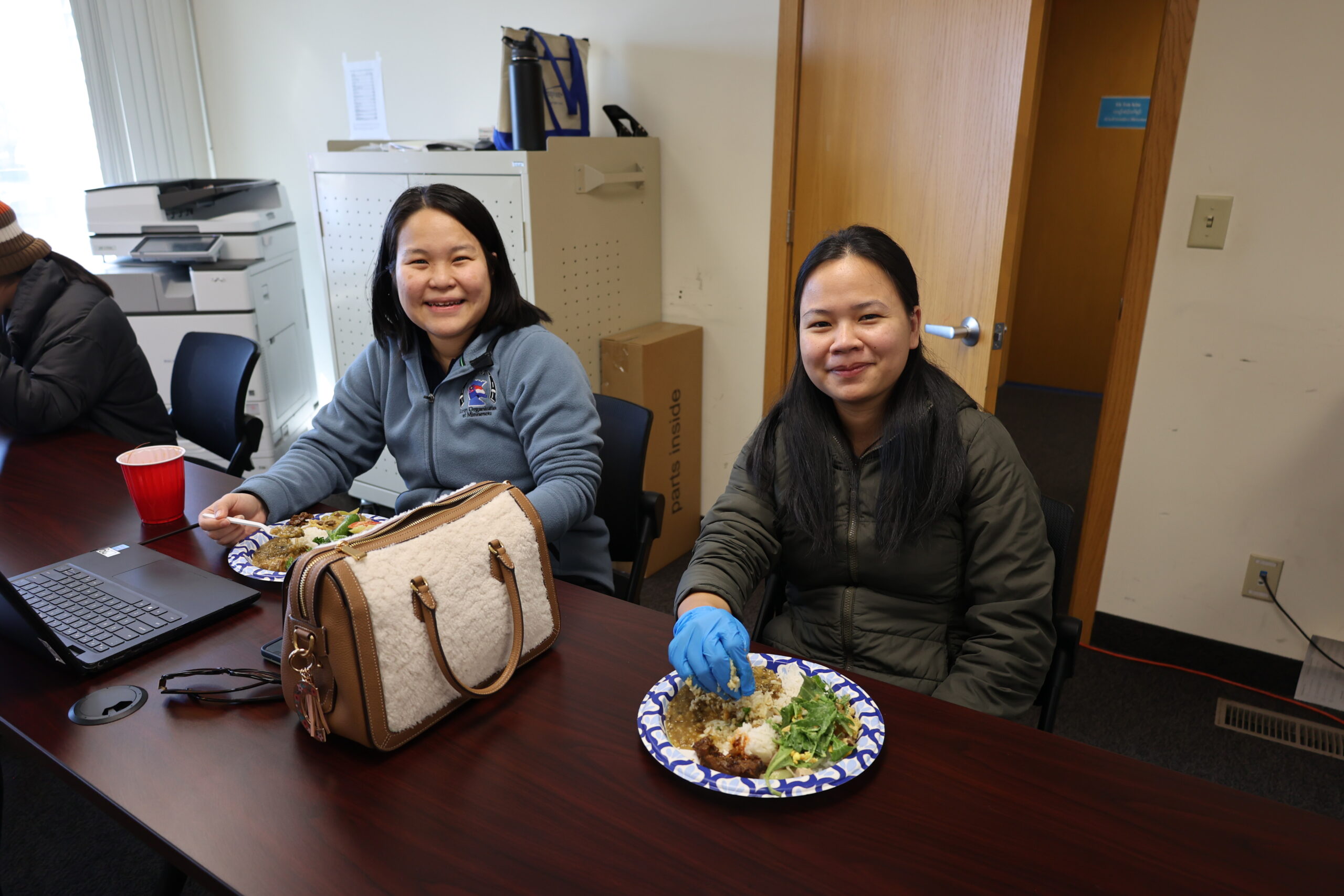 Two of our staff enjoying food after leading a caregivers training.